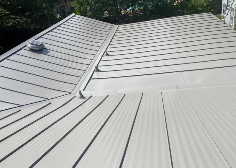 Solar attic fan installed on a metal roof for Roof Ventilation in Point Pleasant